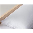 Almohada para bebé Velfont sobre cuna de madera