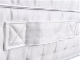 detalle lateral de colchon premium con asas